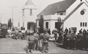 Evacuees in Santa Maria, south of Arroyo Grande, prepare to board the buses that will take them to Tulare on April 30, 1942.